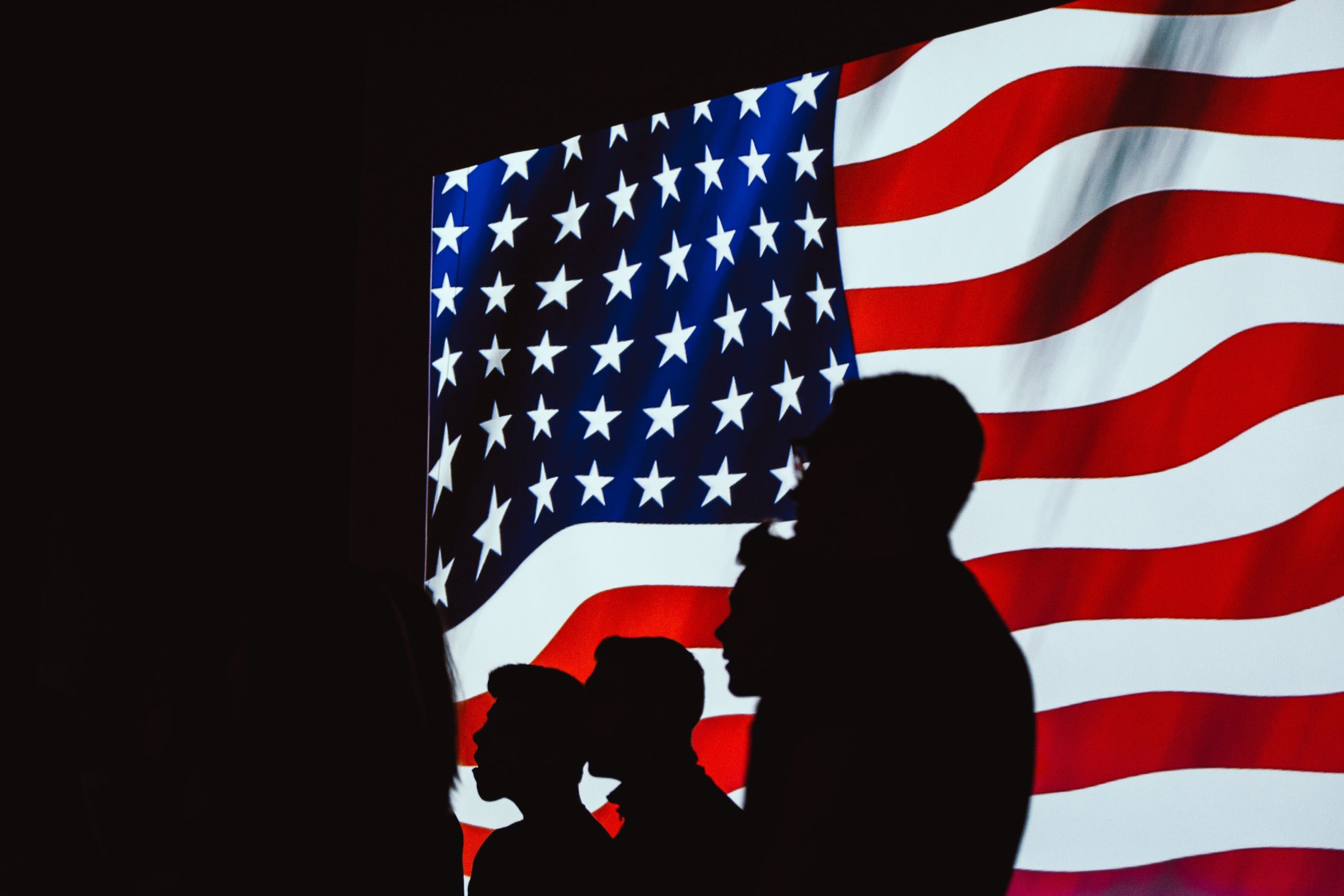 american flag with silhouettes